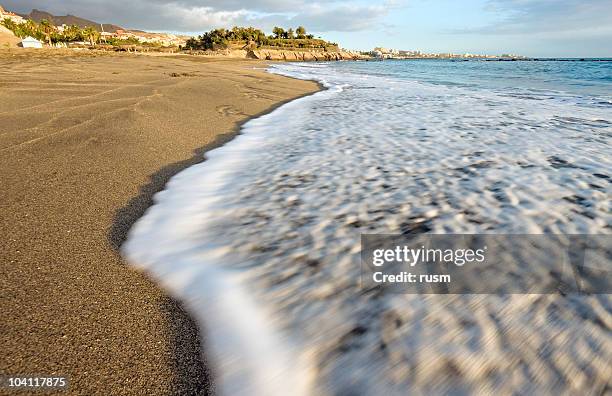 ocean shore, tenerife, spain - playa de las americas stock pictures, royalty-free photos & images