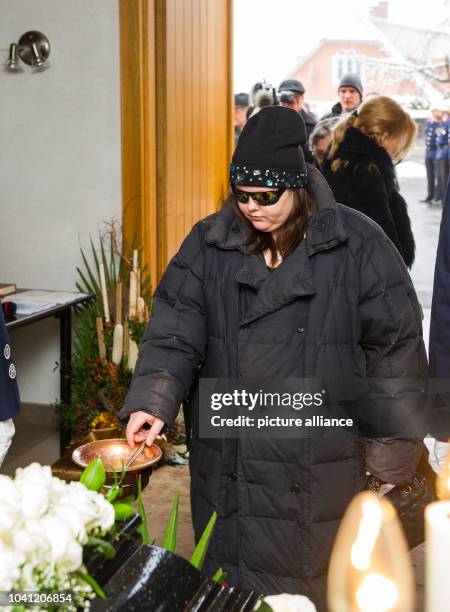 Schell's daughter Nastassja Schell stands in front of the coffin of Swiss-Austrian actor Maximilian Schell during his funeral in his hometown...