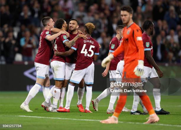 Ryan Fredericks of West Ham United celebrates with his team after he scores his sides fourth goal during the Carabao Cup Third Round match between...