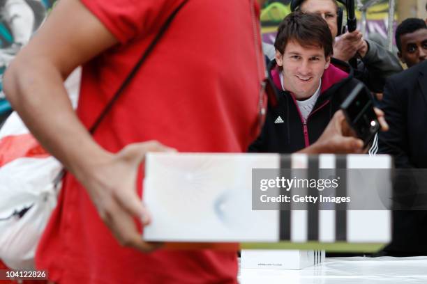Adidas bring footballer Lionel Messi to a market stall in Brick Lane for an unannounced boot amnesty promoting the adidas F50 adizero football boot...