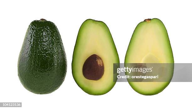 a whole and halved avocado on white - avocado isolated stock pictures, royalty-free photos & images