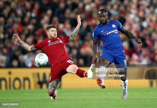 Victor Moses of Chelsea is challenged by Alberto Moreno of Liverpool during the Carabao Cup Third Round match between Liverpool and Chelsea at...