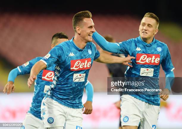Piotr Zielinski and Arkadiusz Milik celebrate the 2-0 goal scored by Arkadiusz Milik during the serie A match between SSC Napoli and Parma Calcio at...