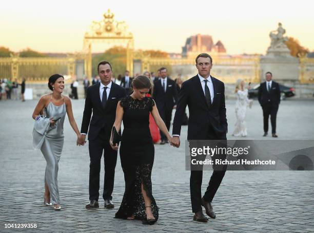 Justin Thomas of the United States and girlfriend Jillian Wisniewski arrive at the Palace of Versailles with Jordan Spieth of the United States and...