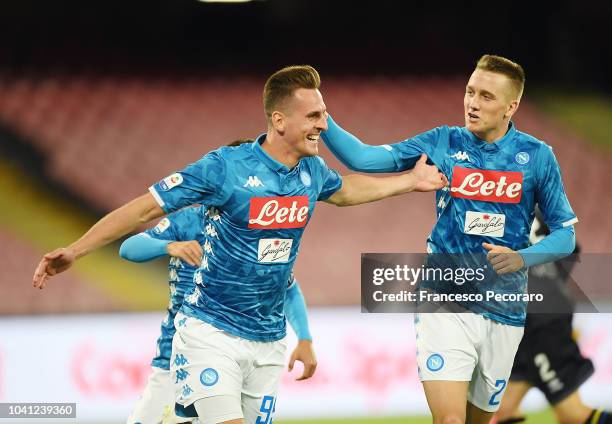 Piotr Zielinski and Arkadiusz Milik celebrate the 2-0 goal scored by Arkadiusz Milik during the serie A match between SSC Napoli and Parma Calcio at...