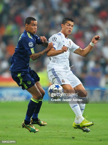 Gregory van der Wiel of Ajax duels for the ball with Cristiano Ronaldo of Real Madrid during the UEFA Champions League group G match between Real...