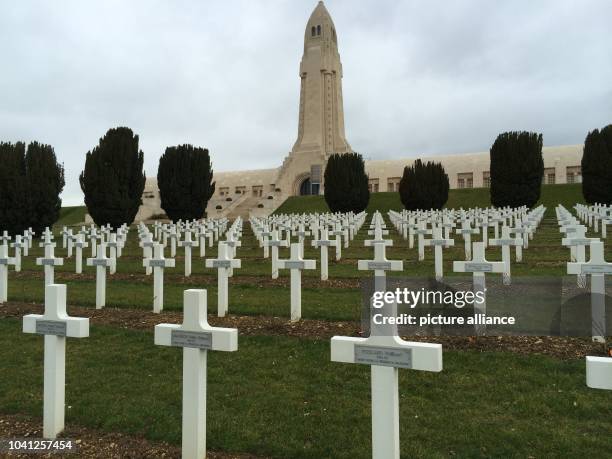 The sky is grey above the white crosses of the soldier cemetery in front of the charnel house of Douaumont, the central memorial place on the...