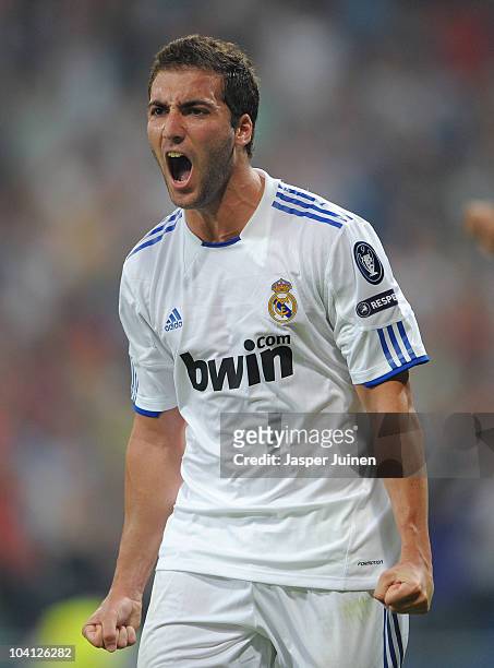 Gonzalo Higuain of Real Madrid celebrates scoring his sides second goal during the UEFA Champions League group G match between Real Madrid and Ajax...
