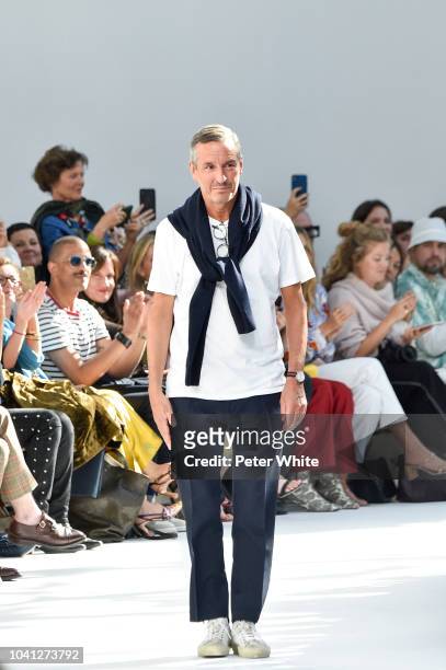 Fashion designer Dries van Noten walks the runway after the Dries Van Noten show as part of the Paris Fashion Week Womenswear Spring/Summer 2019 on...