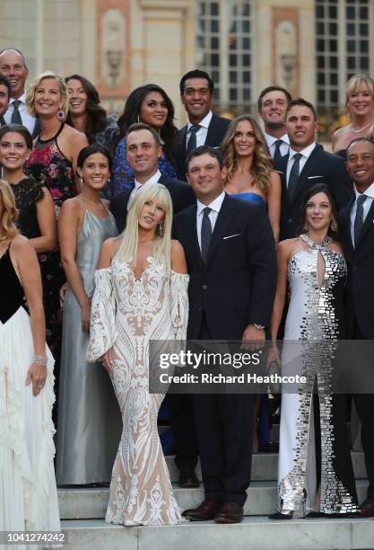 Patrick Reed and his wife Justine Reed pose with Team United States on the steps of the Palace of Versailles before the Ryder Cup gala dinner ahead...