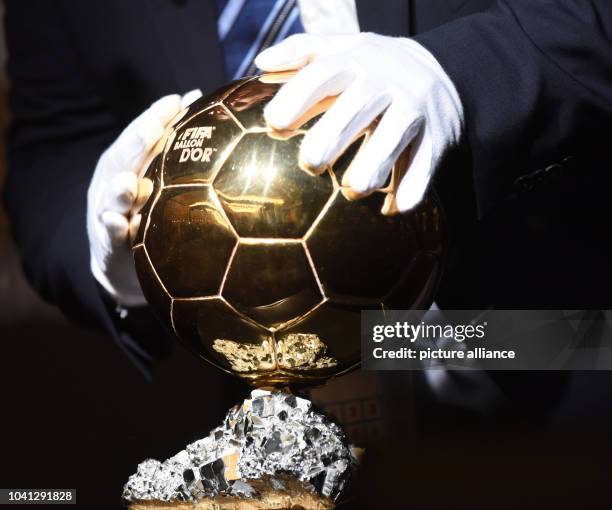 The FIFA Men's World Player of the Year Award is on display during a press conference of the FIFA Ballon d'Or Gala 2015 held at the Kongresshaus in...