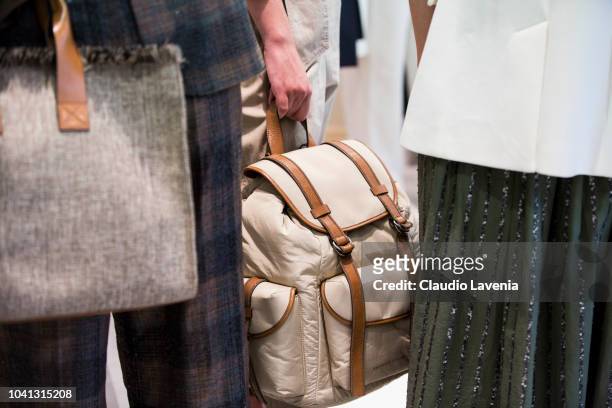 Model, bag detail, is seen at the Brunello Cucinelli presentation during Milan Fashion Week Spring/Summer 2019 on September 19, 2018 in Milan, Italy.