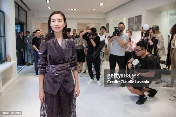 Dong Jie is seen at the Brunello Cucinelli presentation during Milan Fashion Week Spring/Summer 2019 on September 19, 2018 in Milan, Italy.