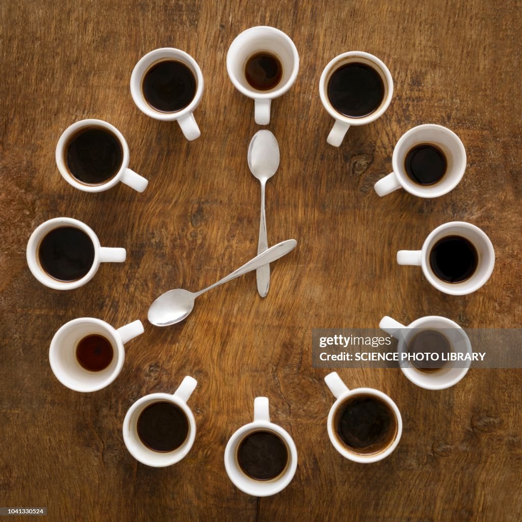 Cups of coffee making the shape of a clock