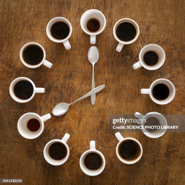 cups of coffee making the shape of a clock - coffee addict stock pictures, royalty-free photos & images