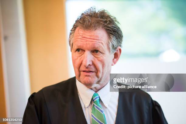 One of the lawyers of the co-prosecution party, Christoph Rueckel, stands in the courtroom on another day of trial against defendant Reinhold Hanning...