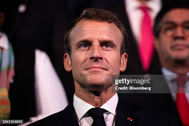 Emmanuel Macron, France's president, smiles during a group photo during the One Planet Summit in New York, U.S., on Wednesday, Sept. 26, 2018. In...