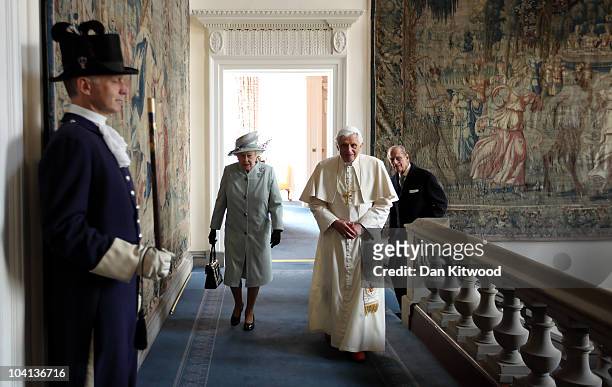 Queen Elizabeth II and Prince Philip, Duke of Edinburgh walk with Pope Benedict XVI to the Morning Drawing Room in the Palace of Holyroodhouse, the...