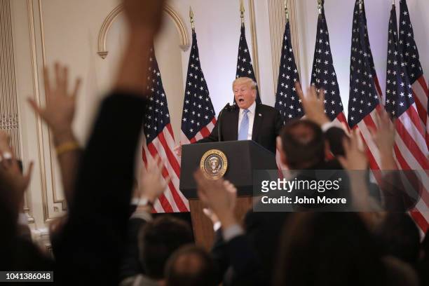 President Donald Trump answers questions at a press conference on September 26, 2018 in New York City. The President held the news event after...
