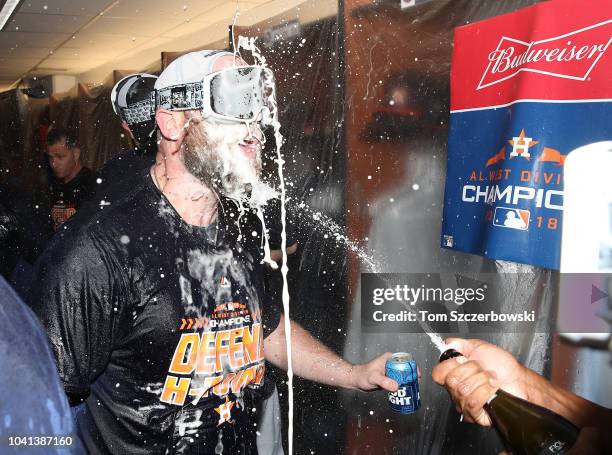 Brian McCann of the Houston Astros celebrates in the clubhouse after the Astros clinched the American League West division title after their MLB game...