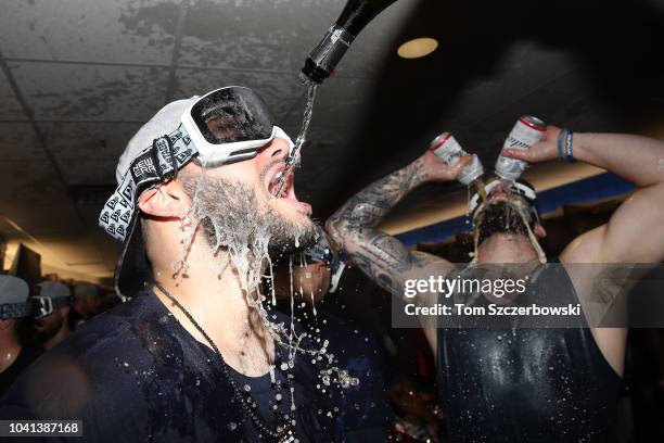 Lance McCullers Jr. #43 of the Houston Astros celebrates in the clubhouse with Dallas Keuchel after the Astros clinched the American League West...