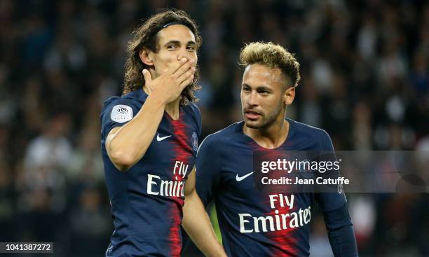 Edinson Cavani of PSG celebrates his goal with Neymar Jr during the french Ligue 1 match between Paris Saint-Germain and Stade de Reims at Parc des...