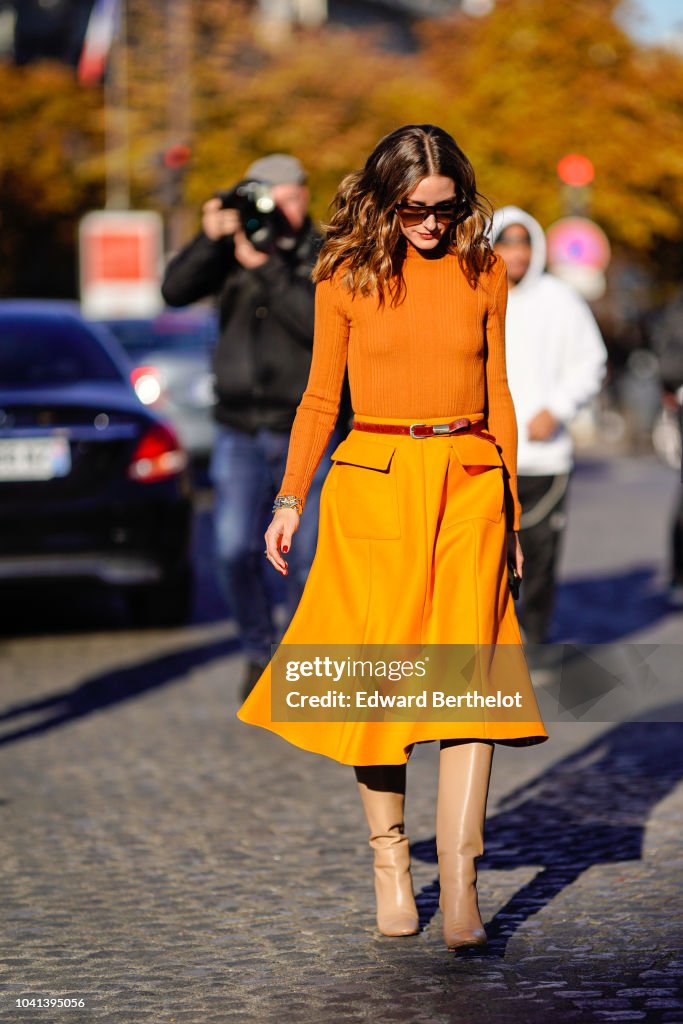 Olivia Palermo wears an orange turtleneck top, an orange skirt, a ...