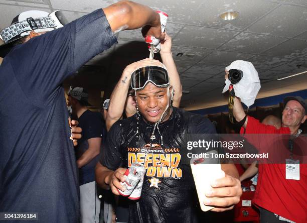 Framber Valdez of the Houston Astros celebrates in the clubhouse after the Astros clinched the American League West division title after their MLB...