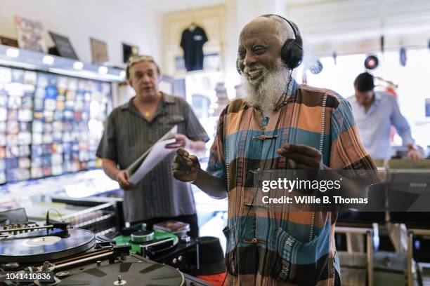 elderly black man with headphones - headphones in store stock pictures, royalty-free photos & images