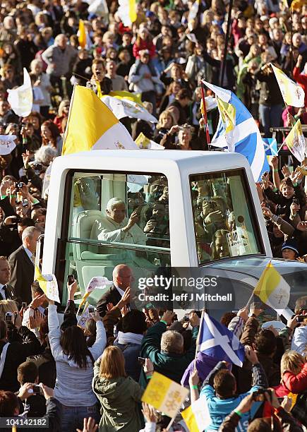 Pope Benedict XVI arrives for the Papal Mass at Bellahouston Park on September 16, 2010 in Glasgow, Scotland. Pope Benedict XVI is conducting the...