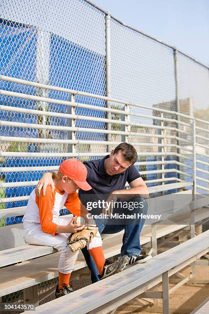 coach giving support to his young baseball player - michael sit stock pictures, royalty-free photos & images