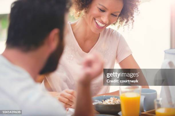 happy couple having breakfast together. - guy with afro stock pictures, royalty-free photos & images