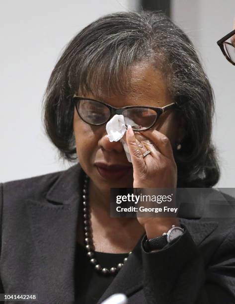 Professor Anita Hill wipes tears from her eyes after she gave a speech to students, faculty and guests on the campus of the University of Utah on...