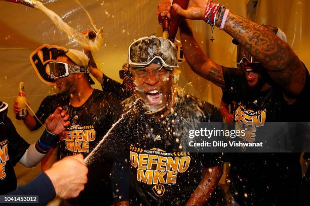 Keon Broxton of the Milwaukee Brewers celebrates with his teammates after clinching a post-season birth at Busch Stadium on September 26, 2018 in St....