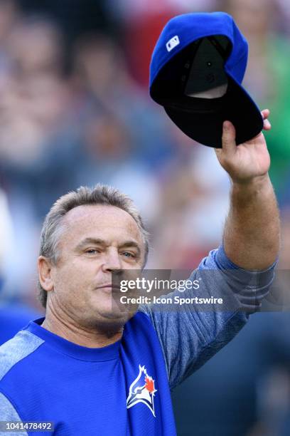 Toronto Blue Jays Manager John Gibbons tips his hat to acknowledge fans after the MLB regular season game between the Toronto Blue Jays and the...