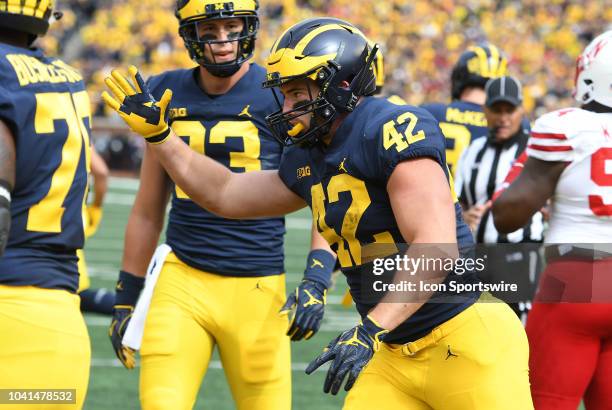 Michigan fullback, Ben Mason, celebrates a touchdown run during the Wolverines' 56-10 win over Nebraska in a college football game on September 22 at...