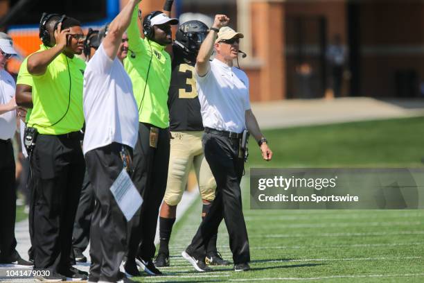 Wake Forest head coach Dave Clawson calls the play during the game between the Notre Dame Fighting Irish and the Wake Forest Demon Deacons on...