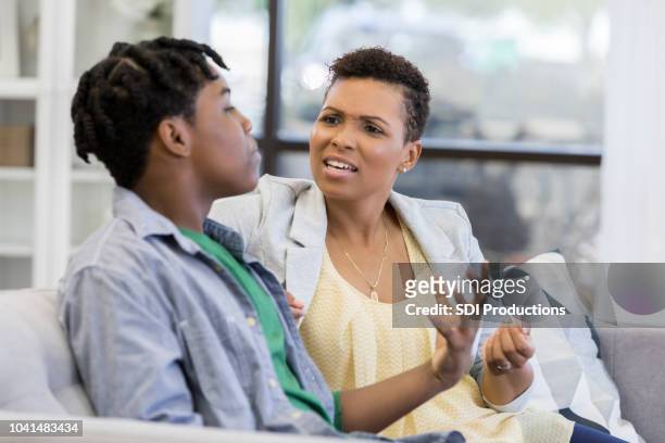 mom argues with son - angry mom stock pictures, royalty-free photos & images
