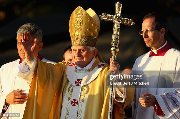 Pope Benedict XVI waves following the Papal Mass at Bellahouston Park on September 16, 2010 in Glasgow, Scotland. Pope Benedict XVI is conducting the...