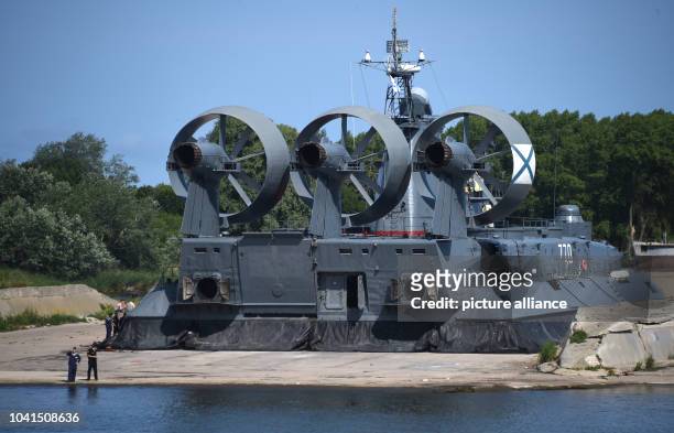 Marines soluting at the naval base in Kaliningrad, Russia, 19 July 2015 in front of a shipwreck of the Russian Navy. In the Russian enclave on the...