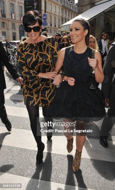 Kim Kardashian and Kris Jenner walk to the Gucci boutique on September 16, 2010 in Paris, France.