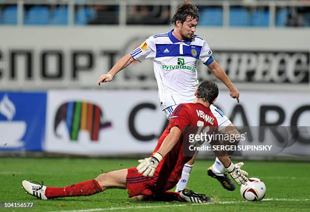 Dynamo Kiev's Artem Milevskiy avoids a tackle from FC Bate's goalkeeper Sergei Veremko to score during their UEFA Europa League play-offs football...