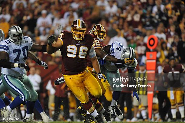 Maake Kemoeatu of the Washington Redskins defends during the NFL season opener against the Dallas Cowboys at FedExField on September 12, 2010 in...