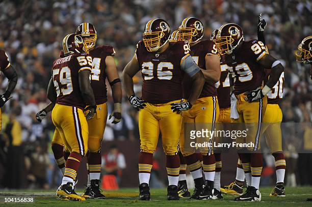 Maake Kemoeatu of the Washington Redskins walks to the line of scrimmage with the defensive line during the NFL season opener against the Dallas...