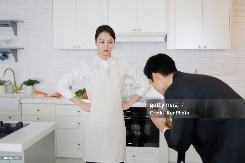 Man apologizing to woman