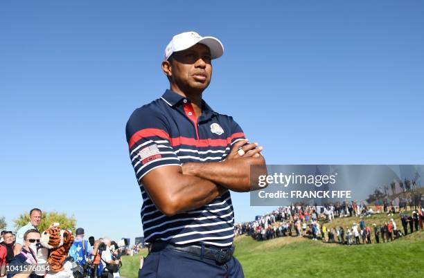 Golfer Tiger Woods looks on during a practice session ahead of the 42nd Ryder Cup at Le Golf National Course at Saint-Quentin-en-Yvelines, south-west...