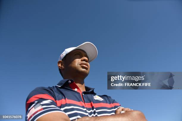 Golfer Tiger Woods looks on during a practice session ahead of the 42nd Ryder Cup at Le Golf National Course at Saint-Quentin-en-Yvelines, south-west...