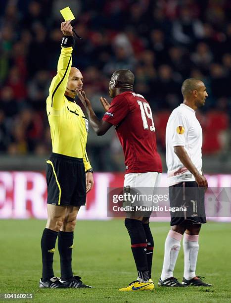 The referee Anastassios Kakos show a yellow card to Adiaba Bondoa of AC Sparta Prague during the Uefa Europa League Group F match between Sparta...