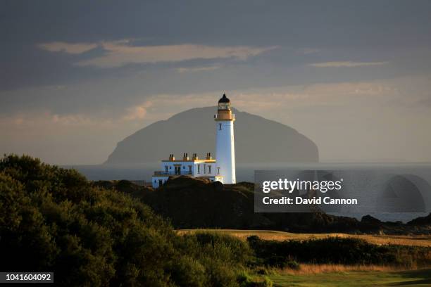 View of the Turnberry Lighthouse with the island of Ailsa Craig behind from the eleventh fairway on the King Robert the Bruce Course at the Trump...