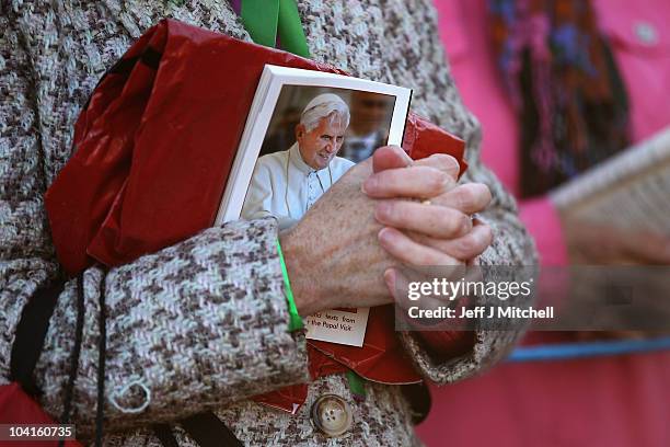 Woman attends the Papal Mass at Bellahouston Park on September 16, 2010 in Glasgow, Scotland. Pope Benedict XVI is conducting the first state visit...